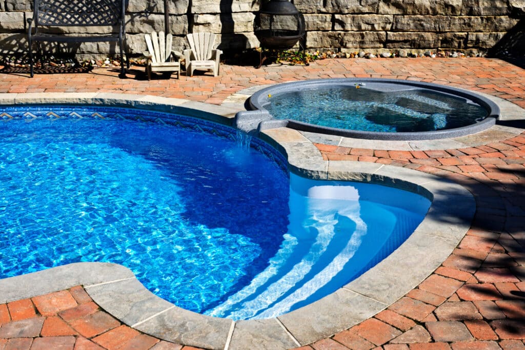 Swimming pool with hot tub