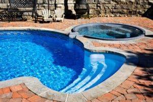 Swimming pool with hot tub